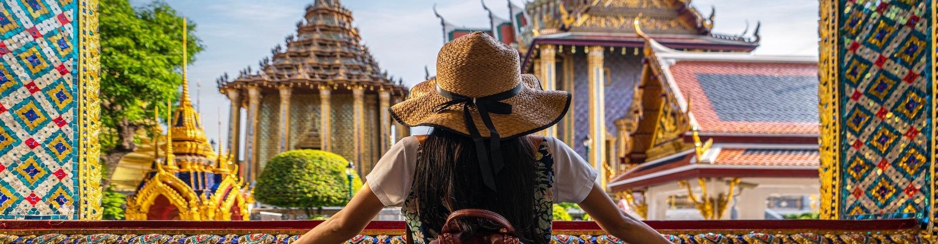 Asian woman traveller take a photo and travel in Bangkok grand palace and wat phra kaew in Bangkok city, Thailand